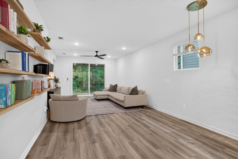 Living room with shelving and ceiling fan at 93 Lochloosa Ct, St. Johns, FL 32259