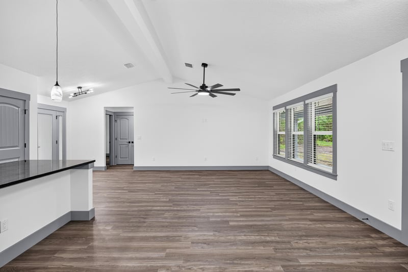 Open living and kitchen area, unfurnished at 4800 Acacia St, Middleburg, FL 32068