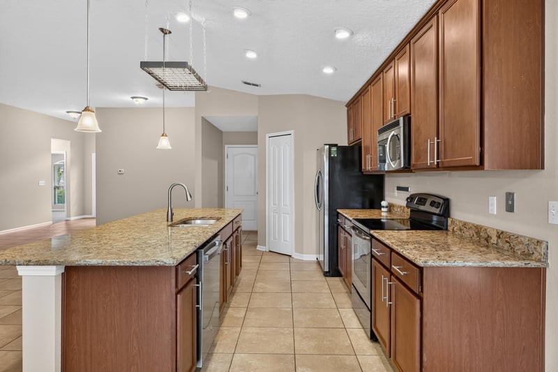 Kitchen view toward sink and cabinets at 469 Glendale Ln, Orange Park, FL