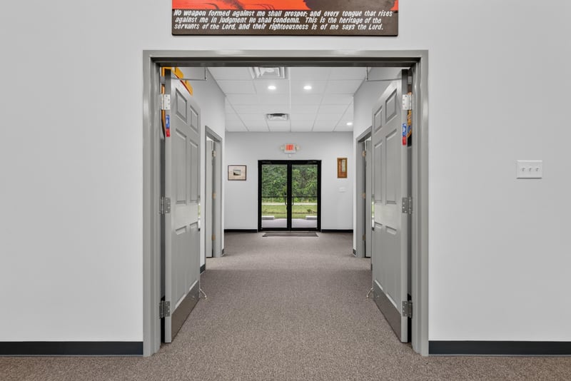 Hallway view toward glass entry doors at 1038 County Rd 315, Melrose