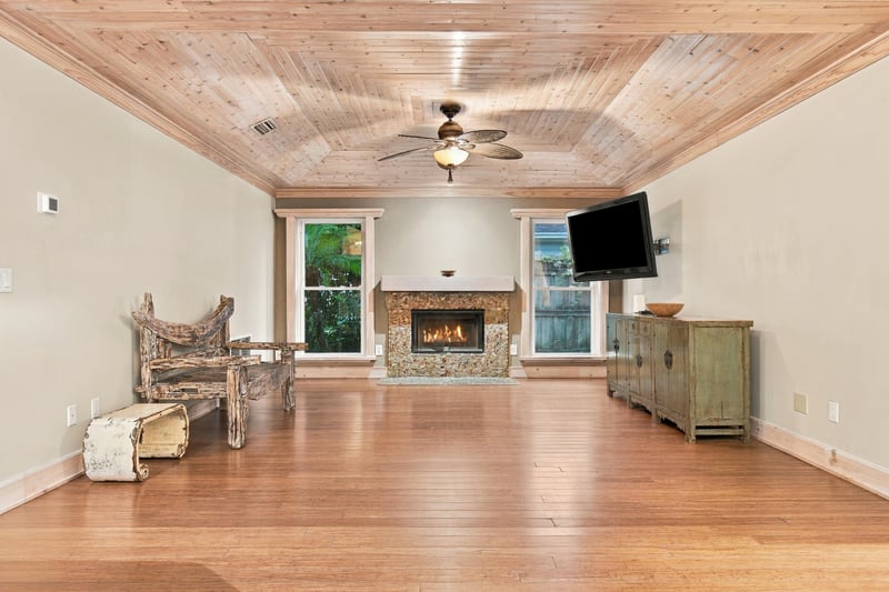Living room with wood ceiling and fireplace, photographed by Megapixeler on Winding Springs Ct, Jacksonville