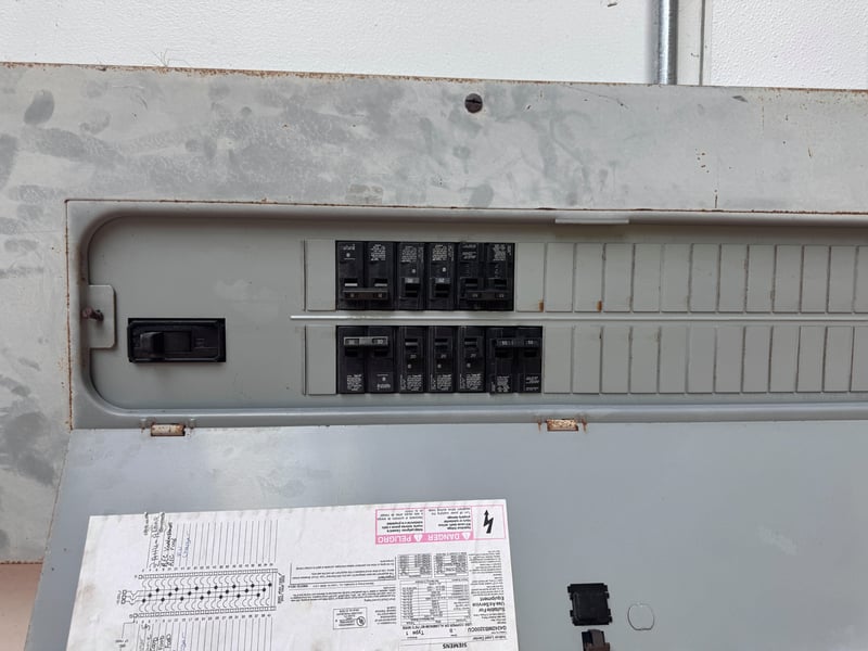 Open panel showing breaker switches at 11700 New Kings Rd, Jacksonville, FL 32219
