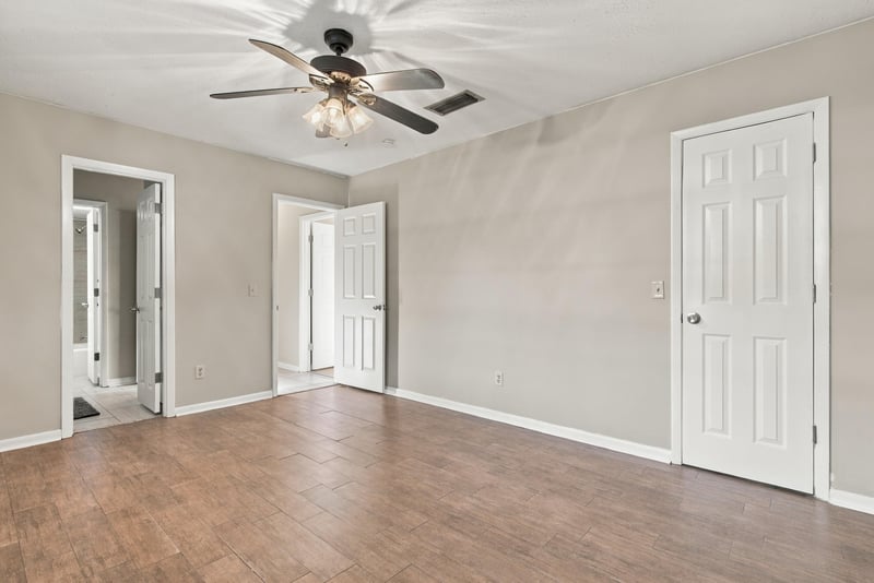 Bedroom interior view with multiple doors, photographed by Megapixeler on Crosby Ln, Orange Park