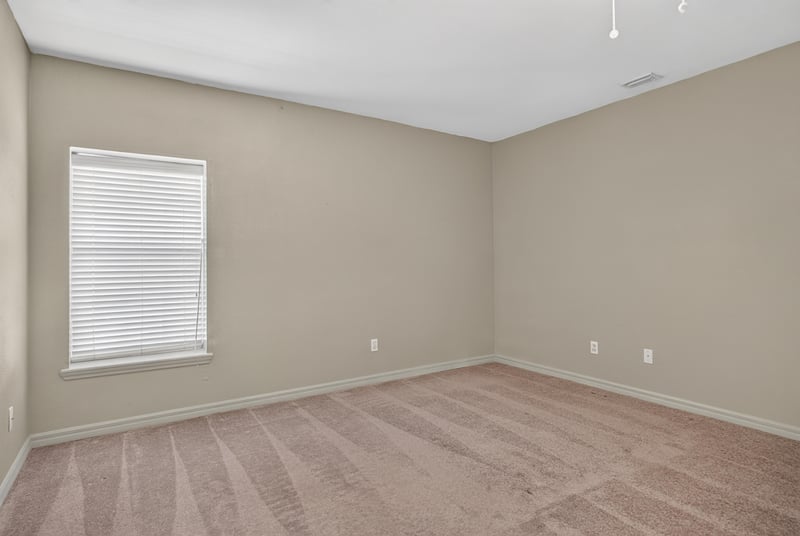 Carpeted room with blinds and window at 342 E Ashley St, Jacksonville, FL 32202