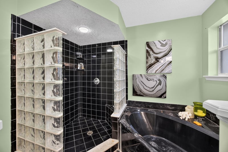 Primary bathroom with glass block shower at 1346 Gately Ct, Jacksonville, FL 32225