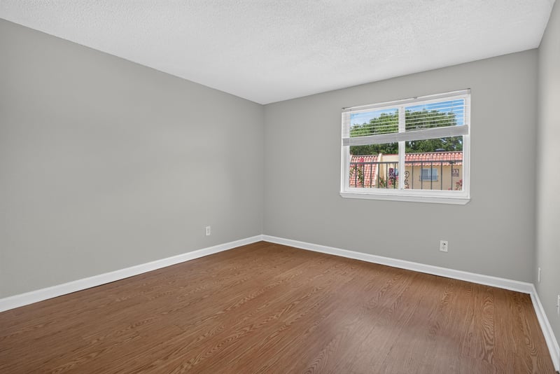 Bedroom with window and wood floor at 3866 Campenero Ct unit 6, Jacksonville, FL 32217