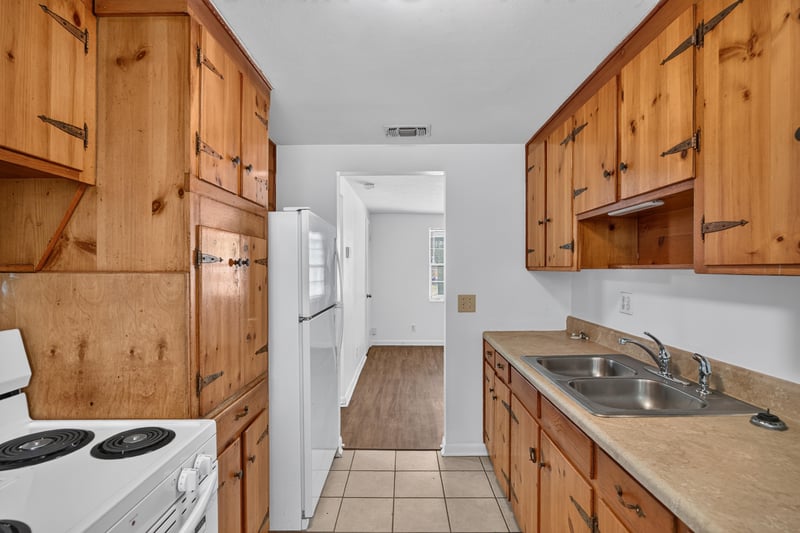 Kitchen with range, sink and tile floor at 5812 Tampico Rd, Jacksonville, FL 32244
