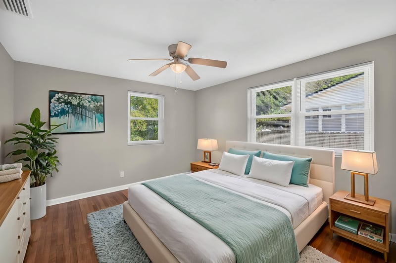 Bedroom staged with bed, artwork and nightstands at 6338 Mercer Cir W, Jacksonville, FL