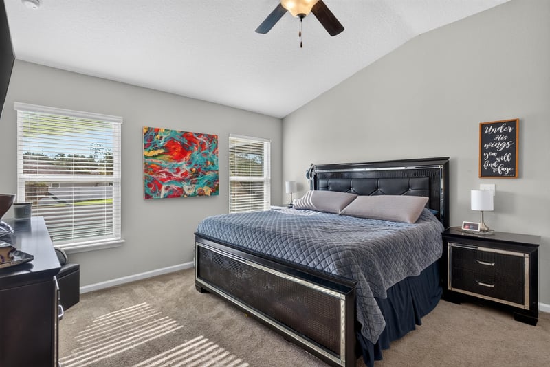 Primary bedroom with vaulted ceiling and ceiling fan at 589 Seville Pkwy, St. Augustine, FL