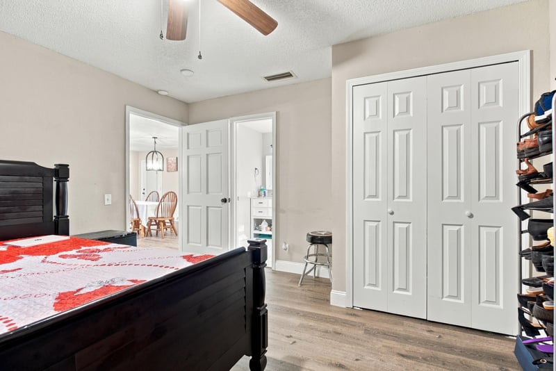Bedroom with closet doors and ceiling fan at 357 Dillon Dr, Orange Park, FL