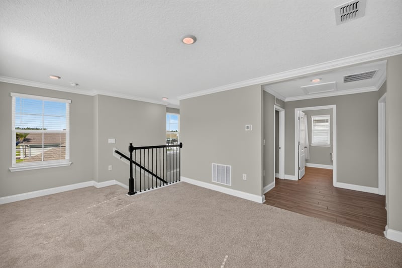 Upstairs hallway with staircase at 331 Millerstone Dr, St. Augustine, FL 32092