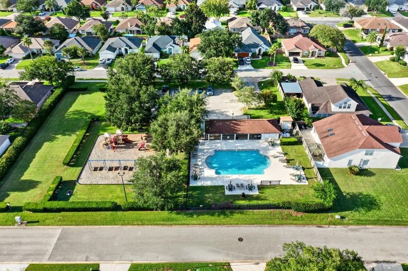 Aerial view of community pool and nearby homes in Johns Creek