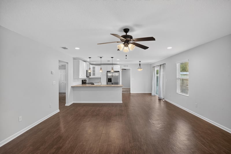 Open kitchen and living area with wood floors at 1002 Ingleside Ave, Jacksonville, FL 32205