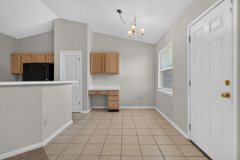 Kitchen with oak cabinets and tile floor at 400 Ashcroft Landing Dr, Jacksonville, FL 32225