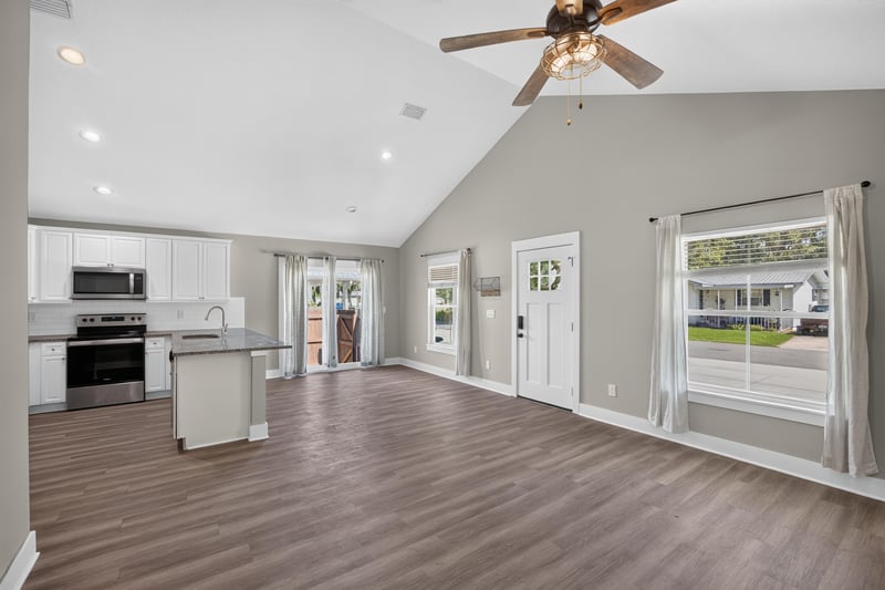 Open living and kitchen area with glass back door at 2855 N 8th St, St. Augustine, FL 32084
