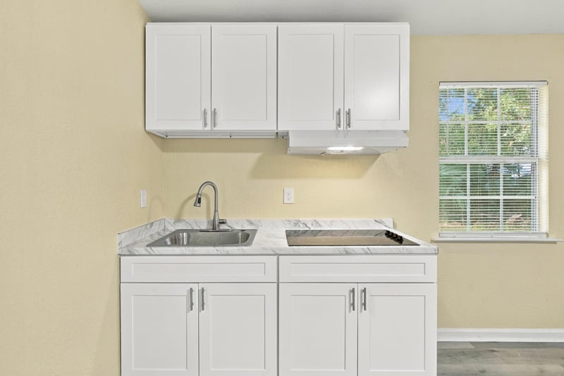 Kitchen cabinetry and sink, photographed by Megapixeler on W 24th St, Jacksonville