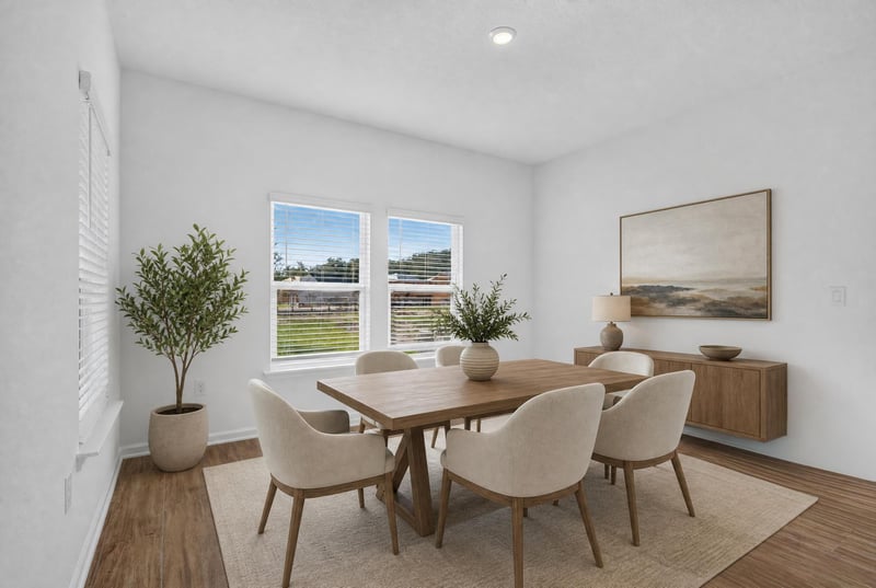 Virtually staged dining area with table and chairs at 269 Bluegrass Wy, St. Augustine, FL 32092