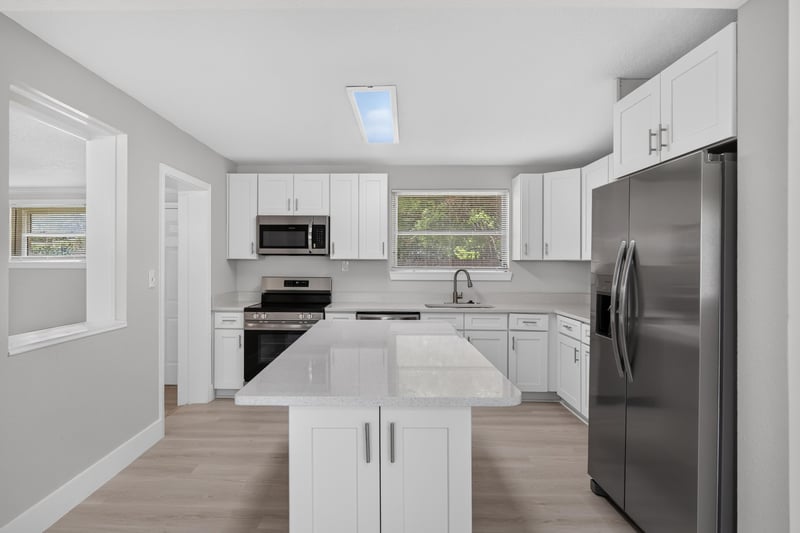 Kitchen with stainless appliances and quartz counters at 6238 Randia Dr, Jacksonville, FL 32210