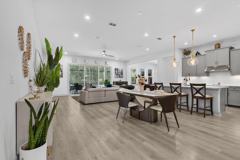 Open kitchen and dining area with island seating at 785 Back Creek Dr, St. Augustine, FL 32092