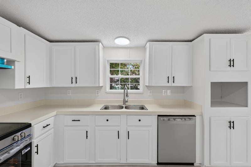 Kitchen sink, cabinets and dishwasher at 7603 Coach Park Dr, Jacksonville, FL 32244