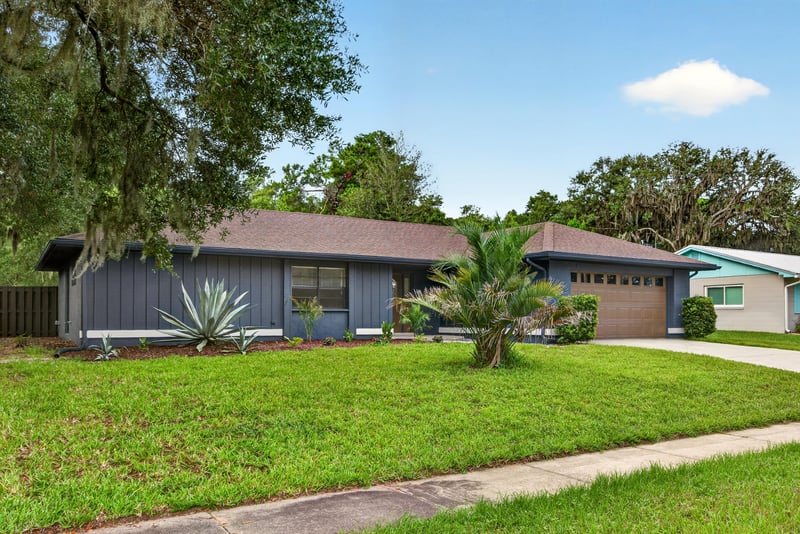Front exterior view across lawn and driveway at 551 Deltona Blvd, St. Augustine, FL 32086