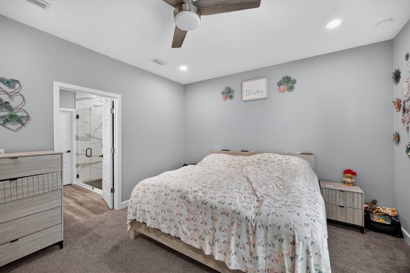 Bedroom with dresser and large window at 2817 Camel Cir, Middleburg, FL