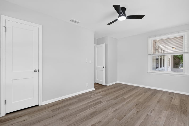 Bedroom with ceiling fan and wood-look flooring at 855 Cornwallis Dr, Jacksonville, FL