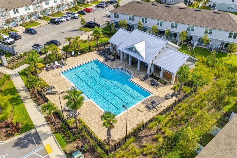 Aerial view of community pool and clubhouse in Equinox East