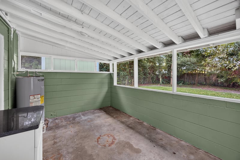Screened porch, beadboard ceiling and concrete floor at 2256 Inwood Cir S, Jacksonville, FL