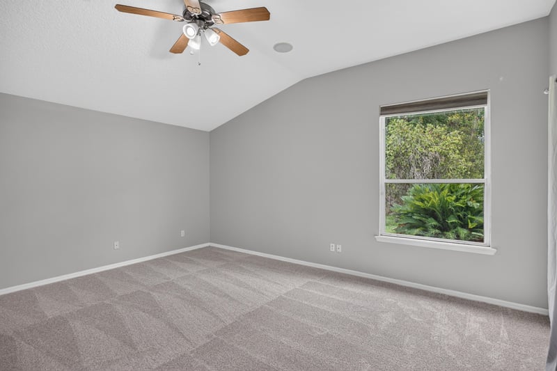Bedroom with window and ceiling fan at 635 Wakeview Dr, Orange Park, FL 32065
