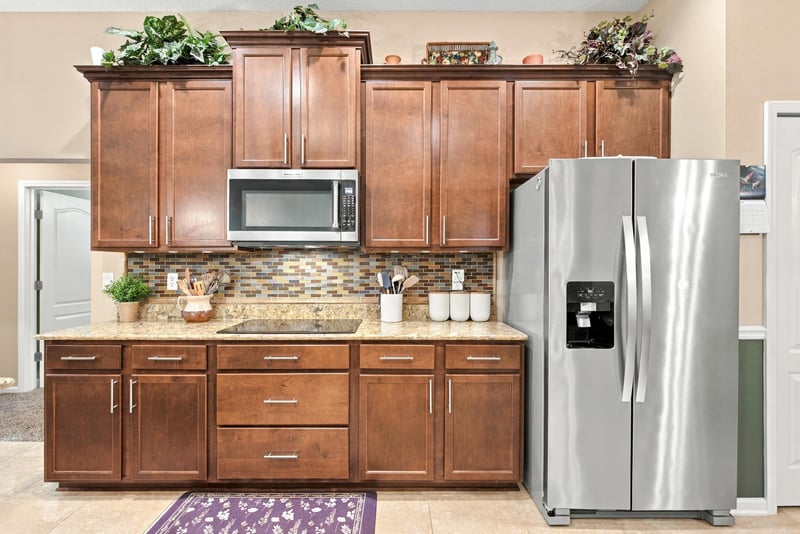 Kitchen with microwave and tile backsplash at 10923 Black Diamond Ct, Jacksonville, FL