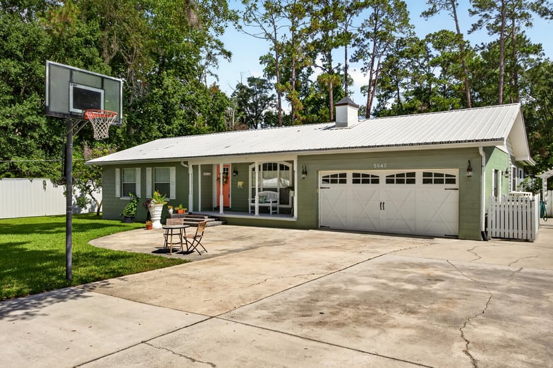 Driveway and garage with basketball hoop at 5843 Ovella Rd, Jacksonville, FL 32244