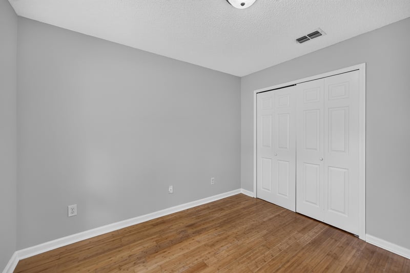 Empty bedroom with closet doors at 456 Bay Point Way N, Jacksonville, FL 32259