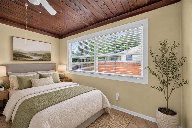 Bedroom with staged bed, wood ceiling and tile floor at 2841 Ernest St, Jacksonville, FL 32205