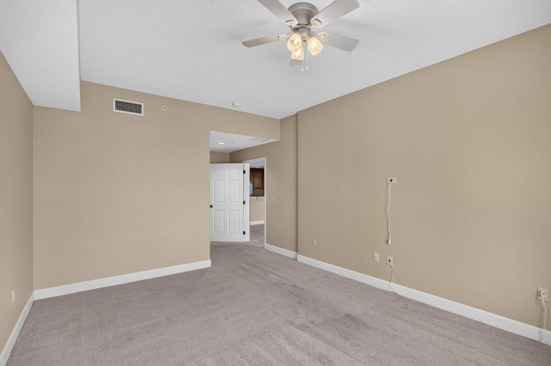 Bedroom with ceiling fan and carpet at 1478 Riverplace Blvd 1904, Jacksonville, FL 32207