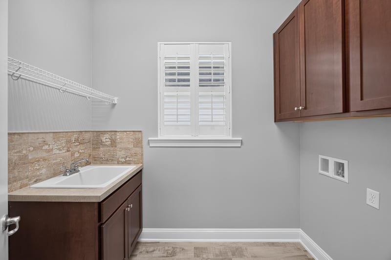 Laundry room with cabinets and sink at 186 Freshwater Dr