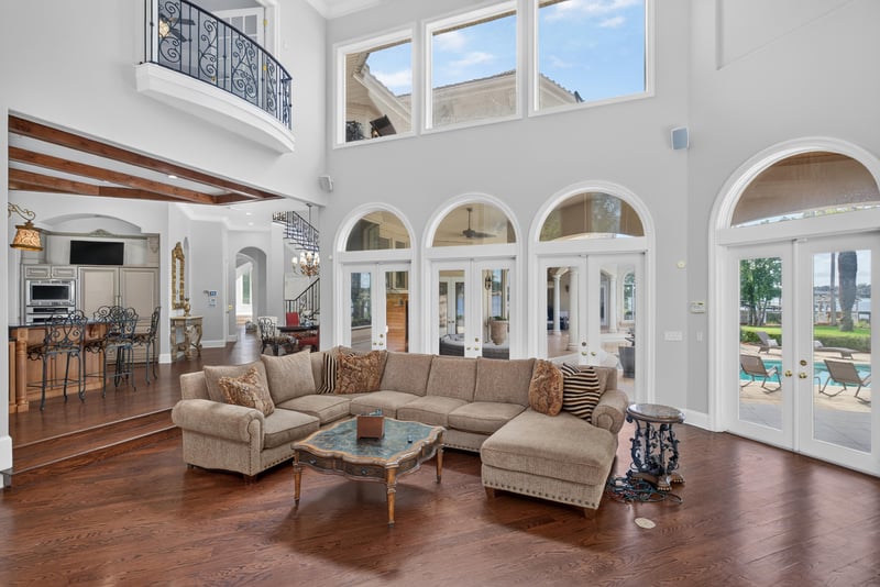 Family room with sectional seating and arched windows at 344 Broward Rd, Jacksonville, FL