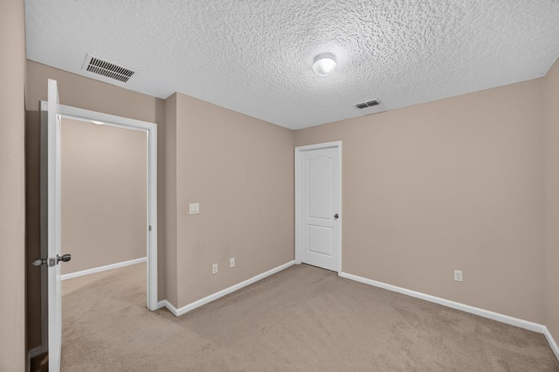 Carpeted bedroom view at 3762 Hartsfield Forest Cir, Jacksonville, FL 32277