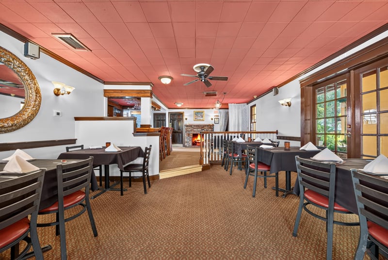 Dining area near the staircase with table seating at 115 Cordova St, St. Augustine, FL