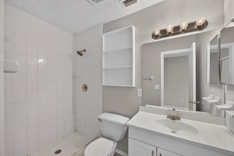 Bathroom with double vanity and mirror at 1083 Stokes St, Jacksonville, FL