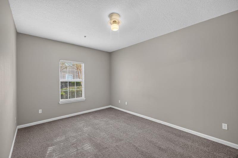 Bedroom with window and carpet at 575 Oakleaf Plantation Pkwy, Orange Park, FL 32065