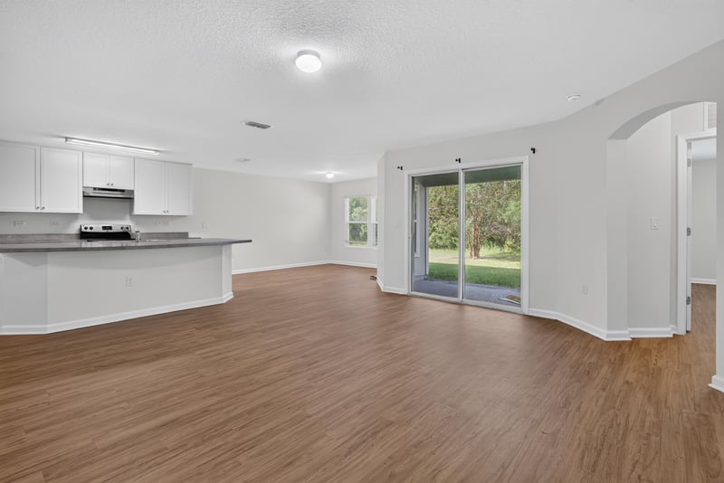 Kitchen island with sliding glass door to yard at 95221 Siena Ct, Fernandina Beach, FL 32034