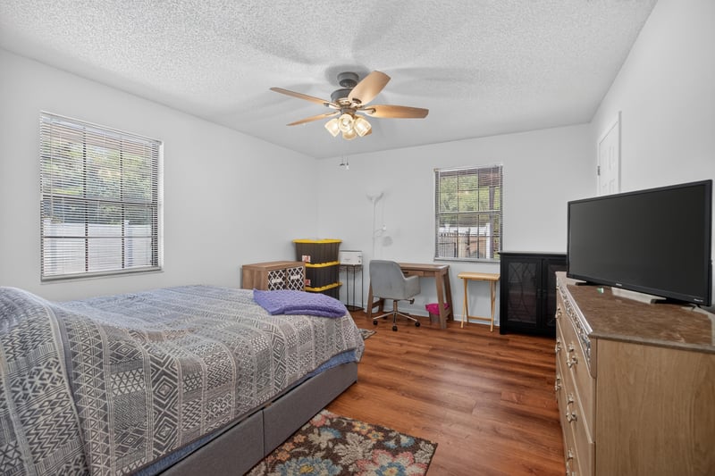 Bedroom with bed and television at 2435 Range Line Rd, Middleburg, FL
