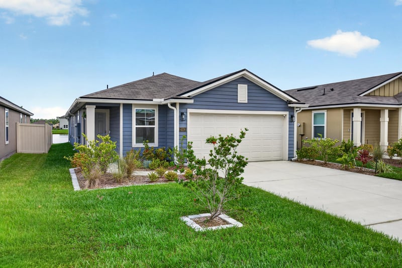 Front exterior view of blue single-story home at 4276 Quaking St, Jacksonville, FL 32218