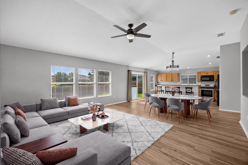 Staged open living room and kitchen at 7545 Lirope St, Jacksonville, FL 32244