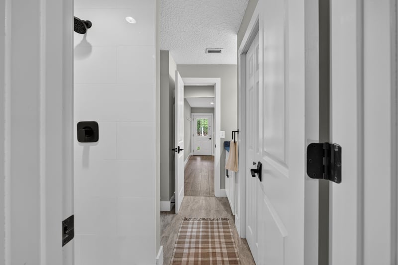 Hallway with multiple doors at 1161 Whispering Pines Rd, Jacksonville, FL 32259