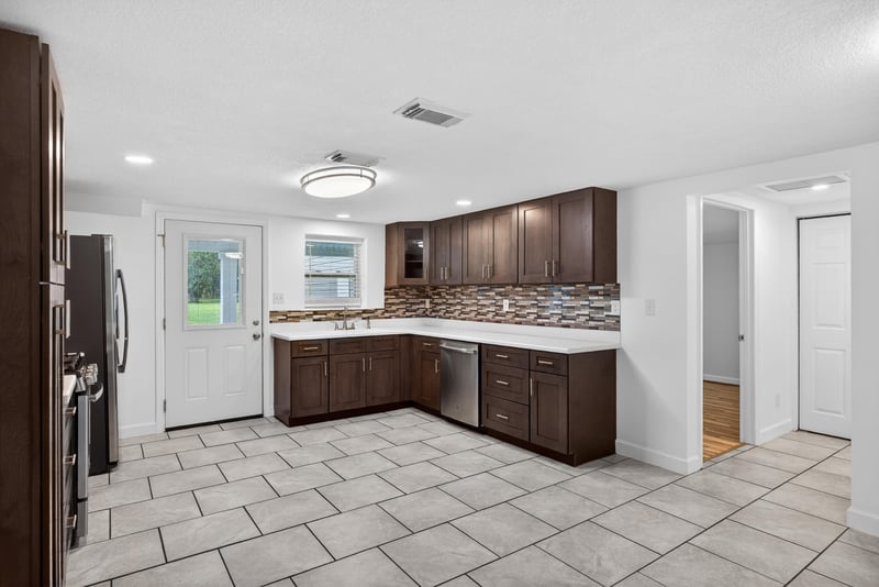 Kitchen view with white countertops and tile flooring at 1619 Hammond Blvd, Jacksonville, FL