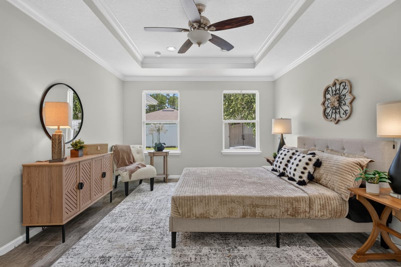 Primary bedroom with dresser and natural light at 10066 Andean Fox Dr, Jacksonville, FL 32222