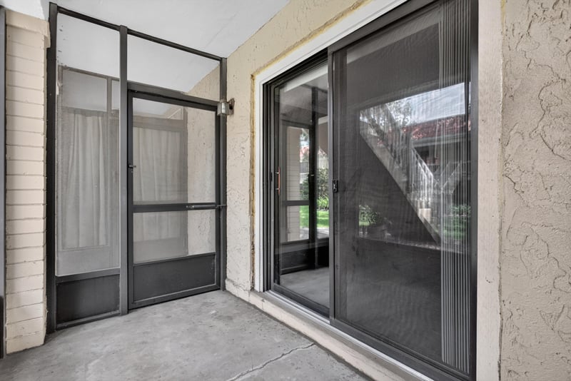 Screened porch with sliding glass door at 5811 Atlantic Blvd unit 47, Jacksonville, FL 32207