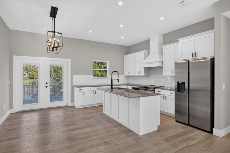 Kitchen with pendant lighting and stainless refrigerator at 175 Alava Ct